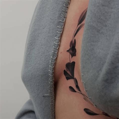 between chest tattoo female|In between chest tattoo for women